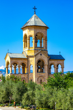 Beautiful view to chapel on site to Sameba Cathedral Tsminda in Tbilisi Holy Trinity . Biggest church Orthodox in Caucasus Georgia region in a sanny day. The main cathedral of the Georgian Orthodoxyの写真素材