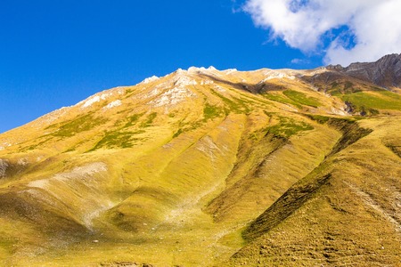 Beautiful view of the landscape of the Georgian military road on a Sunny summer day. The road connects the city of Vladikavkaz, Russia and Tbilisi, Georgiaの写真素材