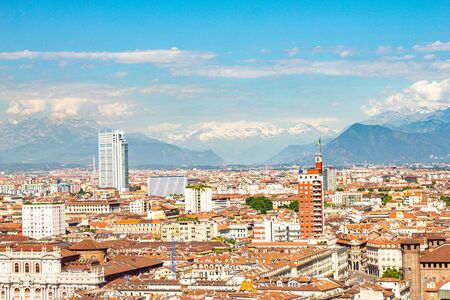 Aerial PAnoramic summer view on Turin skyline, with the city center, Po river, Mole Antonelliana, modern skyscrapers and other landmark seen from viewpoint the Monte dei Cappuccini on snowy alps Italyの写真素材
