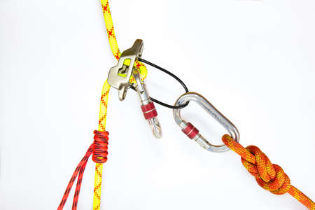 System classic dulfer using belay equipment ATC, isolated on white background. Sport equipment...