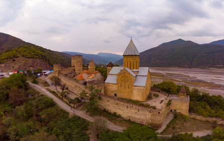 Aerial top view of Ananuri Fortress Complex on Aragvi River. Castle with old medieval orthodox...