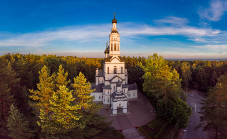 Aerial panoramic top view to Church of the Kazan Icon of Mother of God. Theotokos Cathedral main attraction of city. Rising above green forest. Zelenogorsk, Terijoki, Russia, St. Petersburg. Europe.の写真素材