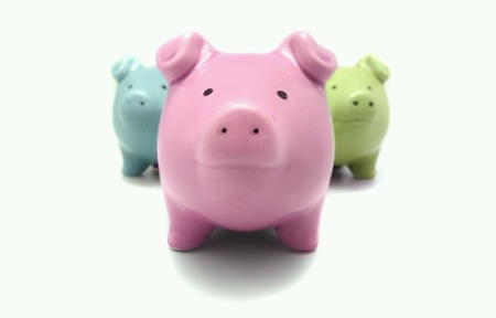 three color pig shape piggy bank on white background の素材