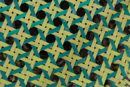 Close up of the octagonal collor green and yellow weave pattern