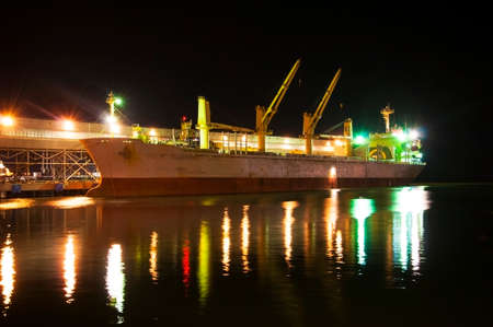 Loading of a vessel in the port of nightの写真素材