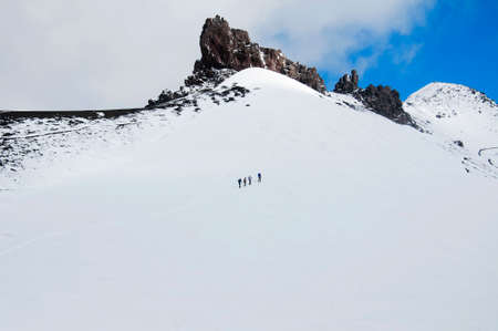 Group of climbers is on snow slope