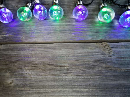 Serenevo-green light bulbs from the garland on the photo from above are lined up in a row.の写真素材