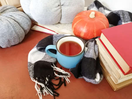 Autumn comfort at home - tea, books and handmade pumpkinsの写真素材