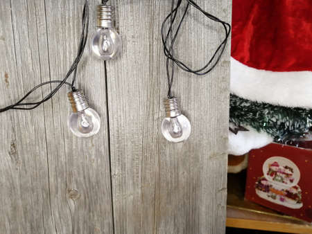 Garland on a wooden wall. Unpacking Christmas decorations.の写真素材