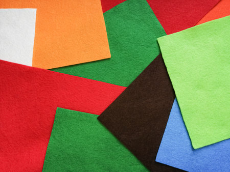 Scattered sheets of colored felt as a background.の写真素材