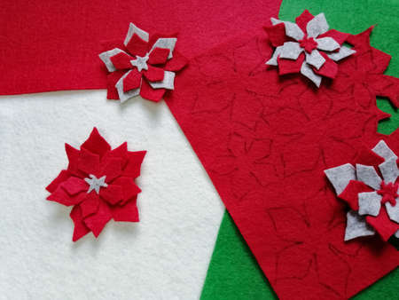 Festive crafts made of felt. Christmas rose - decorations for the New Year and Christmas.の写真素材