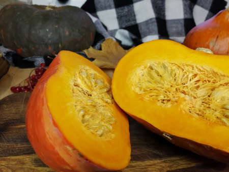 Orange pumpkin cut into two halves. Gifts of Autumn. Harvest.の写真素材