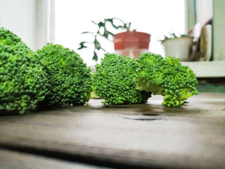 Broccoli cabbage pieces opposite the window. Bright colors, lots of light. It's good for your health.の写真素材