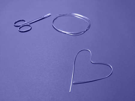 Metal heart made of wire. Homemade blanks for Valentines Day. Color of the Year Very Peri 17-3938の写真素材