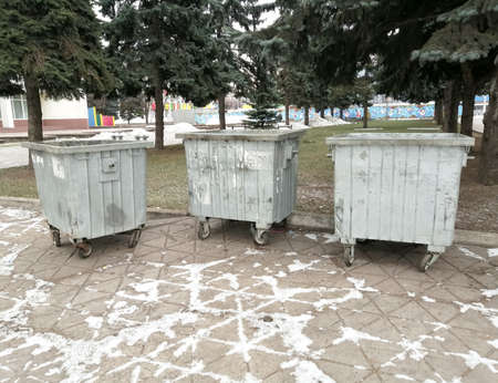 Dumpsters. Old moussor tanks in the city. metal old containers for moussor on the street.