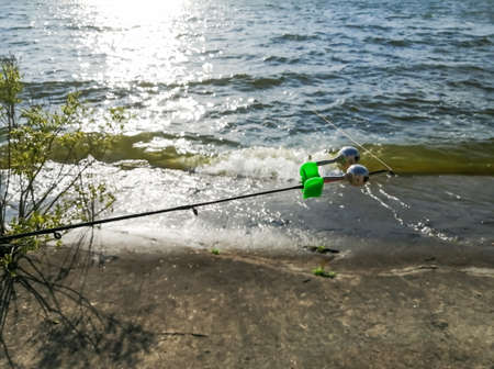 The end of the fishing rod to which the bells are attached. Bells to alert you to fish. A fishing...