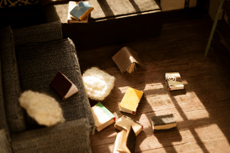 The roombox is an inside view of scattered books and whindow. interior of a miniature house. The house for the doll is scattered books.の写真素材