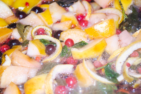 Fruits are boiled in water. Fruits are boiled in water on compote. Preparation of compote. Winter mulled wine with fruit. Preparation of compote - steam closes the fruit.の写真素材