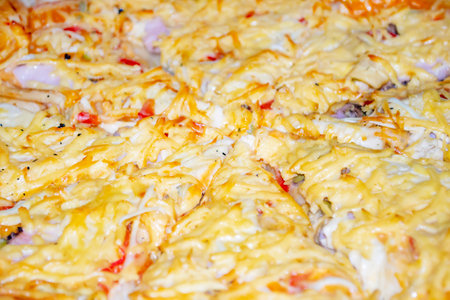 Pizza close-up. Cheese pizza up close. A large, homemade pizza with a bunch of cheese. Hot pizza photo on top.の写真素材