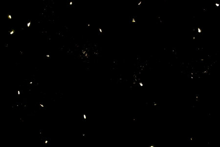 Lights on a black background. Bright highlights on black. Abstraction - stars in a dark sky.の写真素材