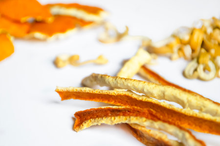 Lots of dried citrus skins. Ingredients for tea are dried tangerines, sweetie and orange. The skin of tangerine, orange and sweetie dried.の写真素材
