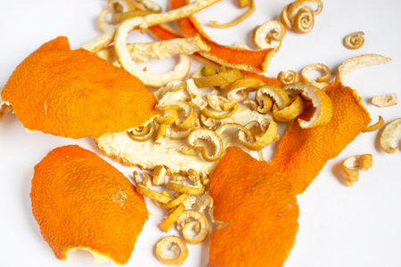 Lots of dried citrus skins. The skin of tangerine, orange and sweetie dried. Ingredients for tea are dried tangerines, sweetie and orange.の写真素材