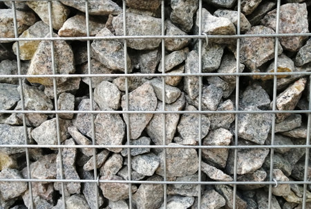 gabion. the wall is made of galvanized mesh and stone. the original fencing is gabion.の写真素材