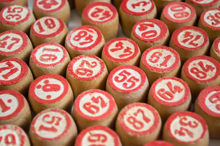 Barrels are wooden with red numerals. A lot of barrels from the lotto on a white background.の写真素材