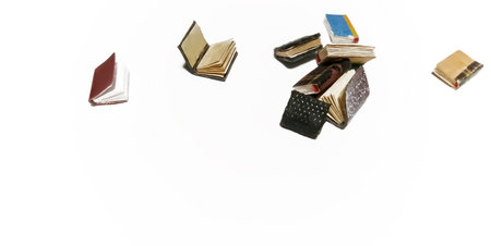 Toy books on a white background. Miniature books on a white background. beautiful little books.の写真素材