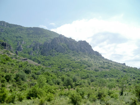 The landscape is mountainous. mountain view. high mountains with green trees and beautiful skies. The beauty of nature in the mountains.の写真素材