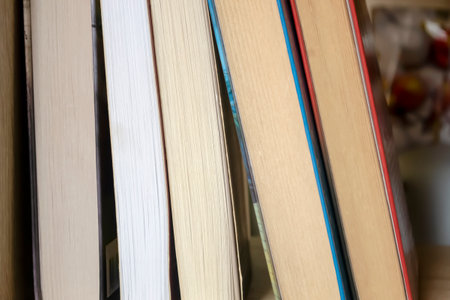Books are on the shelf. learning material in the closet. Several books stand next to each other.の写真素材