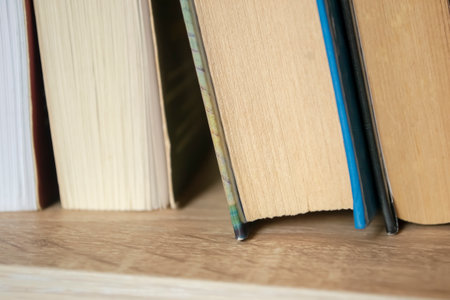Books up close. On the shelf are books - close shooting. The bottom of the book is on the shelf.の写真素材