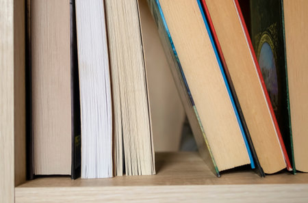 Books are on the shelf. Several hardcover books are in the closet.の写真素材