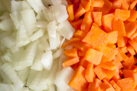 Carrots and onions - background photo. Chopped vegetables - onions and carrots background image. Equally chopped onions and carrots.の写真素材