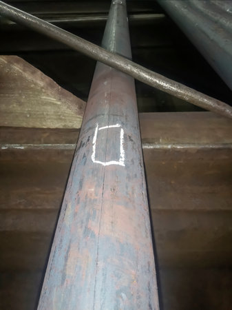Black mettalurgy. Finished metal - the blank for the circle. circle is processed to eliminate defects. On the metal, the places of defects for processing are marked with white chalk.の写真素材