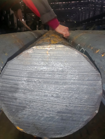 Black mettalurgy. blank for the circle. Finished metal - the circle is processed to eliminate defects. On the metal, the places of defects for processing are marked with white chalk.の写真素材