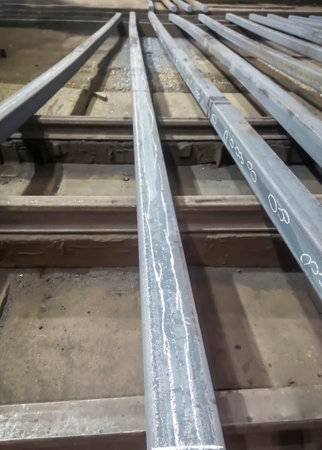 Metal processing before sorting. The square is processed in the factory. Eliminate defects on the square before sorting and sending. Metal production at the factory.の写真素材