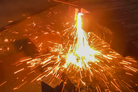 Metal processing at the factory. metallurgy. Work at a foundry metallurgical plant. The machine processes metal. Gas cutting machine for metal.の写真素材