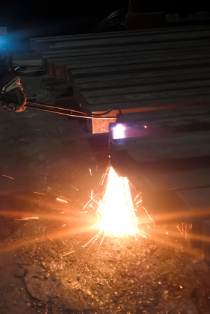 Metal processing at the factory. metallurgy. Work at a foundry metallurgical plant. The machine processes metal. Gas cutting machine for metal.の写真素材
