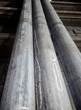 Metal is a circle for processing by workers. metallurgy. Work at a foundry metallurgical plant. Acceptance and sorting of metal.の写真素材
