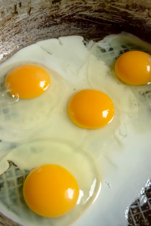 Fried eggs in a pan. protein breakfast. A few fried eggs. fried eggs in a pan. Eggs with bright yolks.の写真素材