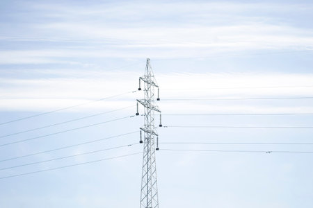 A power pole. Power transmission is a pillar against the sky. Electricity lines on a field. A lot of...