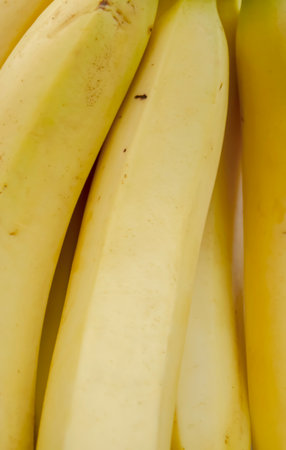 Banana background photo. A few bananas close-up. yellow bananas. ripe bananas up close.の写真素材