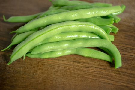 Asparagus on a wooden board. Green asparagus. Healthy green legumes in summer. Legumes for...
