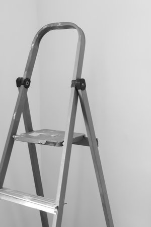 The staircase is folding in the room. Renovation in the room - a folding summer box against the...