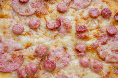 Pizza with salami. fried pizza close to cheese and sausage. Sausages and sausage with cheese in pizza.の写真素材