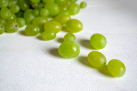 Close-up of grapes berries. Green grapes on white background.の写真素材