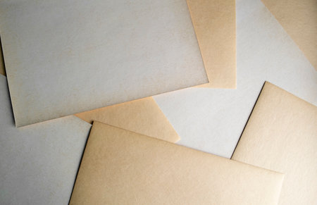 Sheets of paper in the form of a background. Aged paper lies in the background. chaotically scattered sheets of paper. Watercolor paper.の写真素材