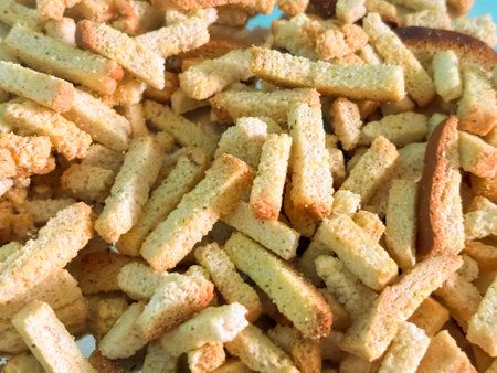 croutons on foil. Junk food - crackers with different flavors. breadcrumbs. Food additives in crackers.の写真素材