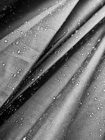 Water drops on black fabric. Water drops on black cloth.の写真素材